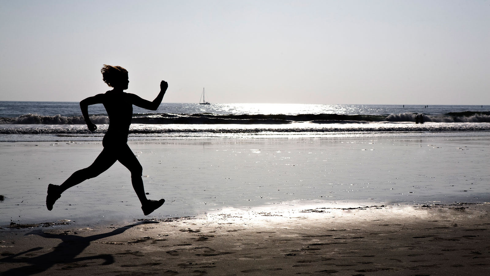 Woman Running by the beach