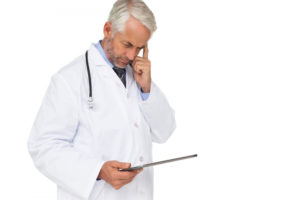 When a Drooping Eyelid Is Serious Doctor holding a clipboard