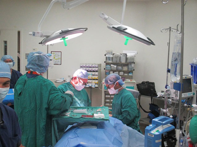Doctors and nurses performing surgery