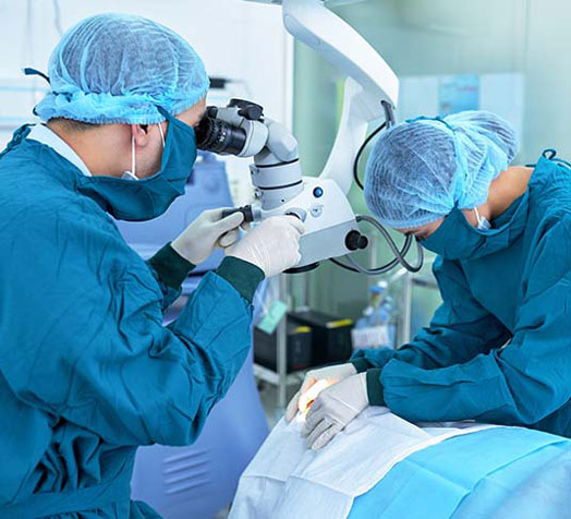 Eye surgeons performing surgery