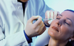 Woman having botox injections